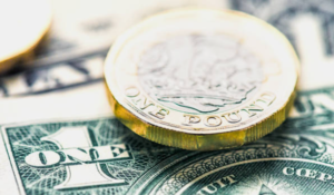 Pound Gains Against Weaker Dollar Amid Cautious Market Sentiment